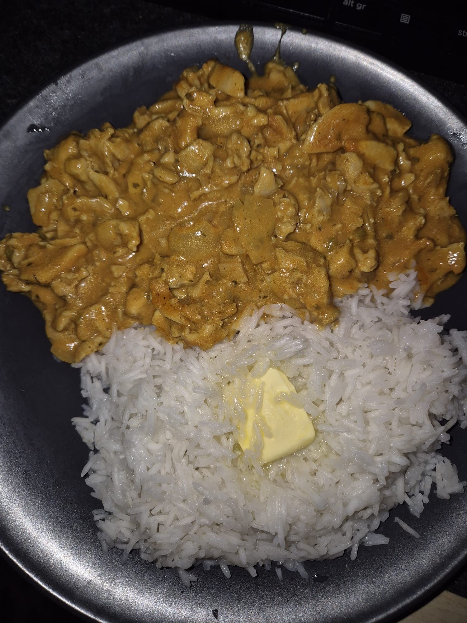 Plate of chicken tikka masala with rice