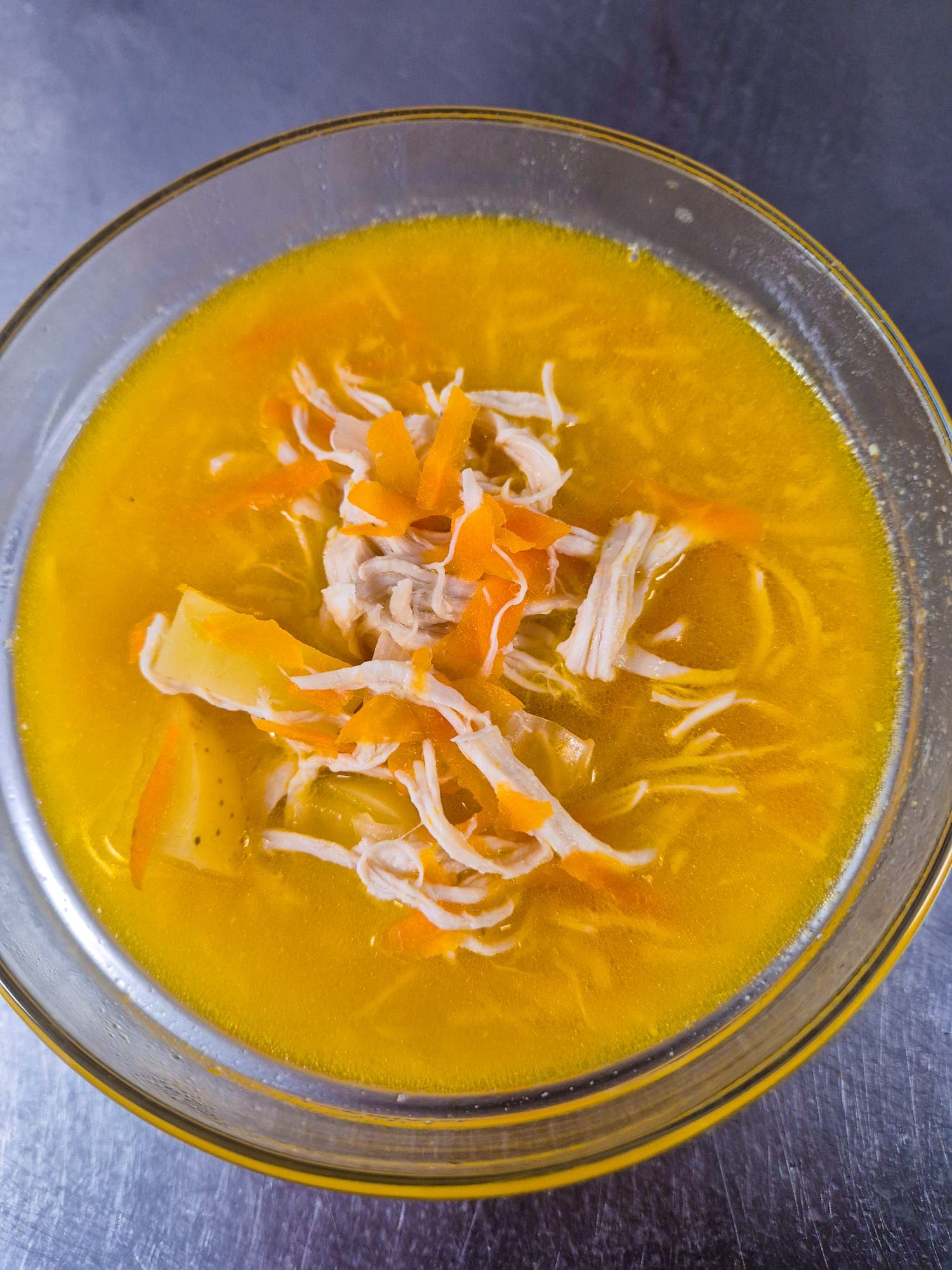 Warm bowl of winter soup with bread on the side